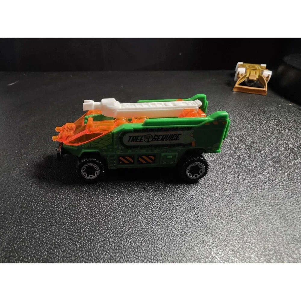 Lot of 4 loose Hot Wheels vehicles in pre-owned condition.